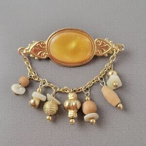 Vintage Gold Tone Oval Brooch with Dangling Beads and Chain Design